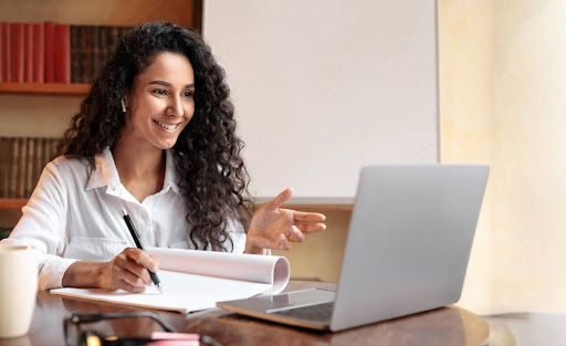 girl using laptop for online learning