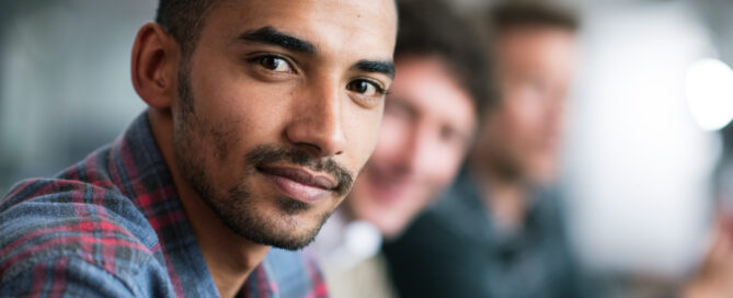 Man focusing into camera